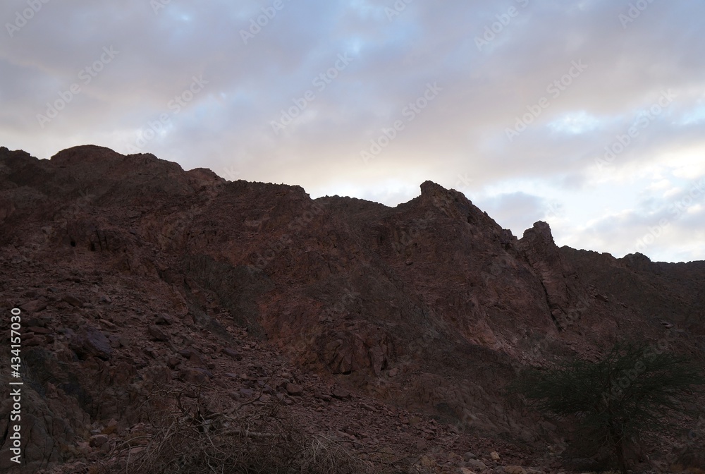 Hiking in mountains near Eilat, Israel, twilight time Hiking in mountains near Eilat, Israel, twilight time