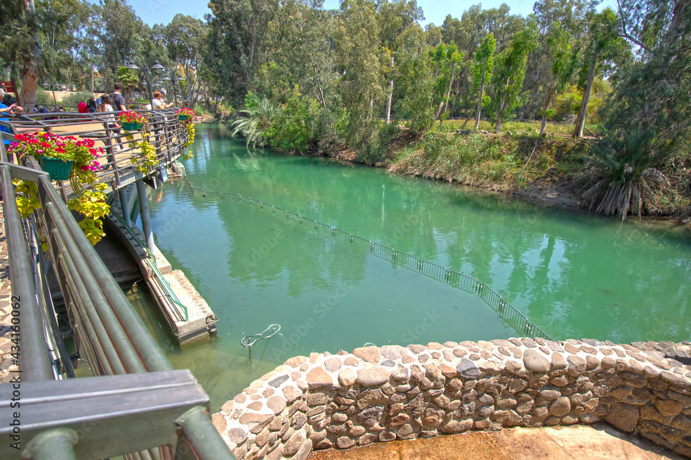 Naklejka premium Shore of Jordan River, Yardenit Baptismal Site in the Galilee on the Jordan River, Israel 