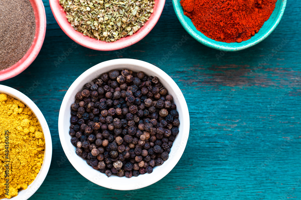 Colourful various vegatable and spices for cooking on blue background Colourful various vegatable and spices for cooking on blue background