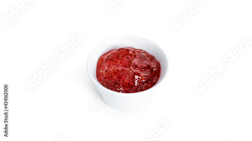 Jam in gravy boat isolated on a white background.