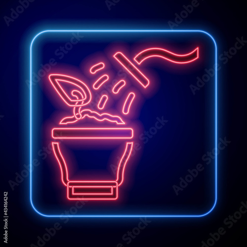 Glowing neon Spraying a house plant with a spray gun icon isolated on black background. Moistening of foliage. Care for home flowers. Vector