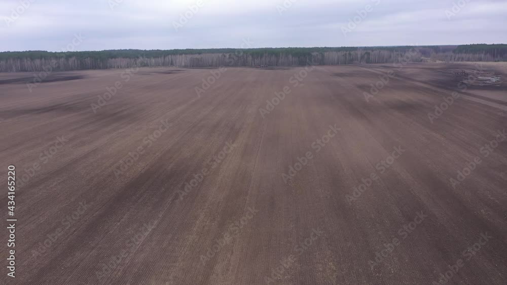 Agricultural fields on a cloudy evening, aerial view. Landscape. Treated soil. Land for planting agricultural plants.
Agricultural fields on a cloudy evening, aerial view. Landscape. Treated soil. Land for planting agricultural plants.