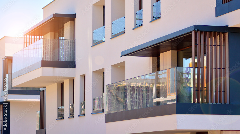 Apartment residential house and home facade architecture and outdoor facilities. Blue sky on the background. Sunlight in sunrise. Apartment residential house and home facade architecture and outdoor facilities. Blue sky on the background. Sunlight in sunrise.