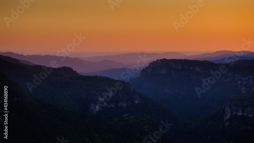 Closeup shot of a landscape with colorful sky after sunset