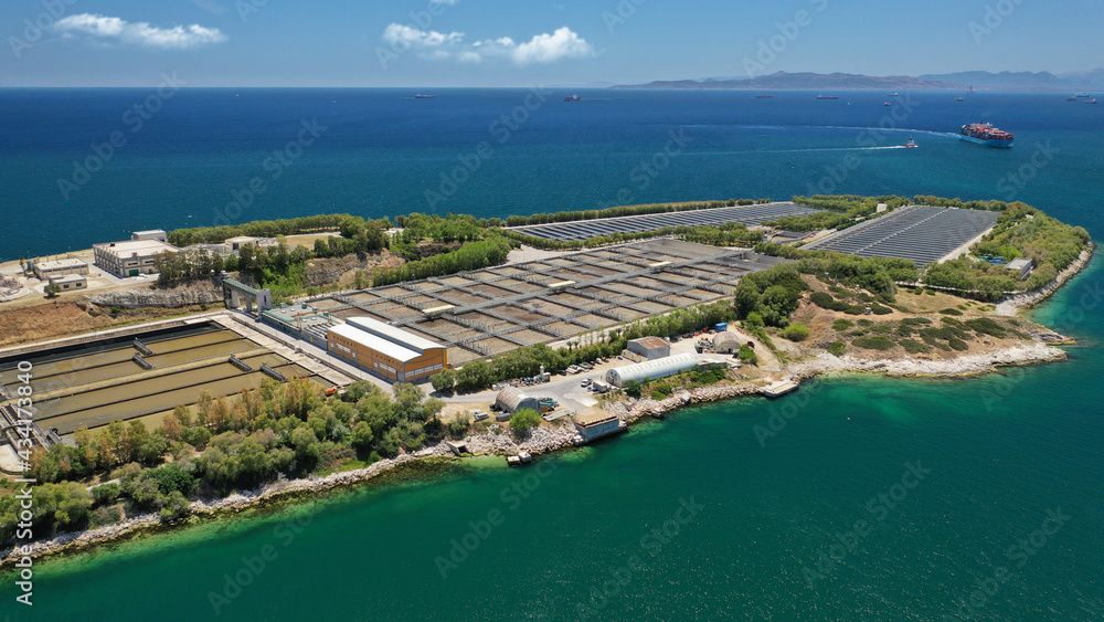 Aerial drone photo of latest technology sewage and sludge processing plant in small island of Psitalia or Psyttaleia, Piraeus, Attica, Greece
