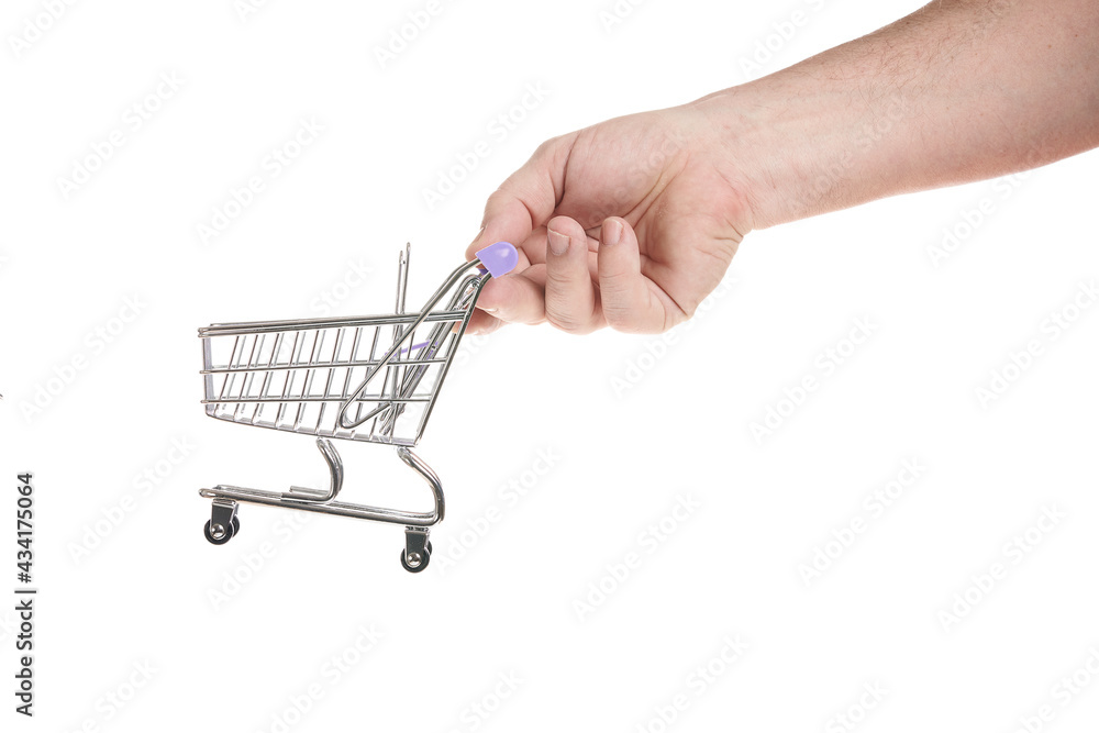 Hand holds a trolley from a supermarket on a white background Hand holds a trolley from a supermarket on a white background