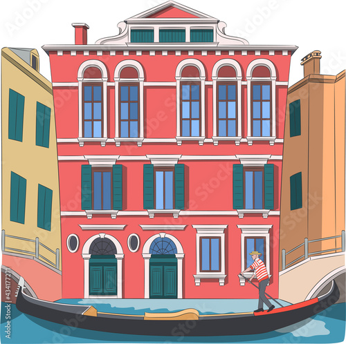 A gondolier in a gondola boat sails along the canal of Venice.