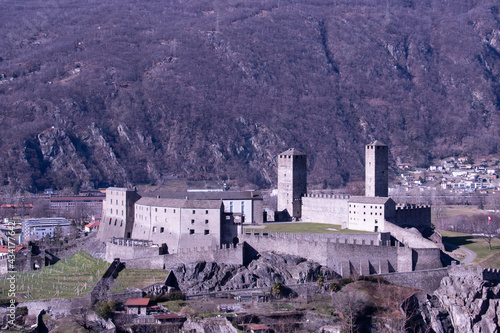 View of beautiful ancient city of Bellinzona in Switzerland with Castelgrande castle from Montebello photo