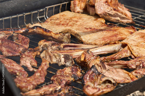 cooking on a charcoal and wood barbecue