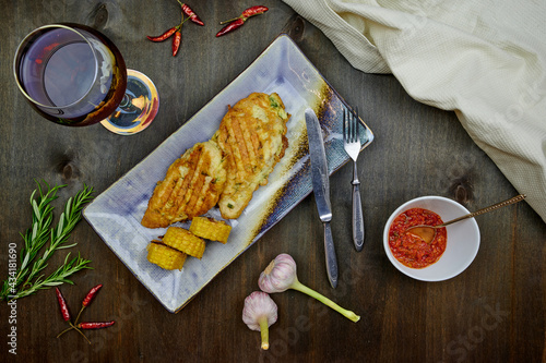 chicken in batter and corn with pomegranate juice
