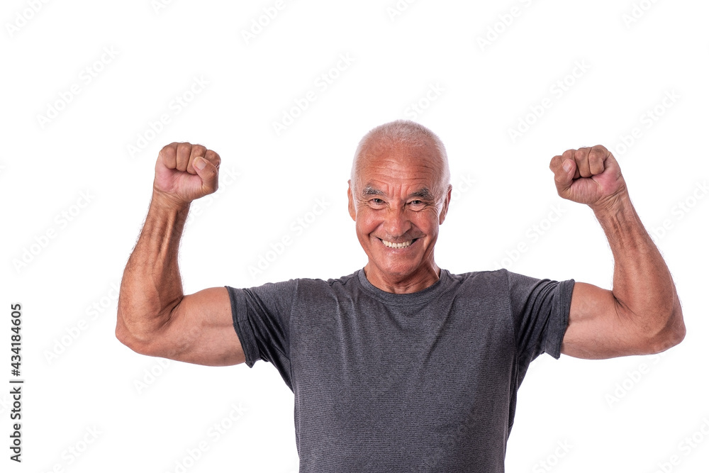 An elderly man, an athlete in excellent physical shape, celebrates a victory with cheerful emotions. On a white isolated background. An elderly man, an athlete in excellent physical shape, celebrates a victory with cheerful emotions. On a white isolated background.