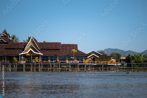 A big yellow house on the riverside in Inle Lake, Myanmar