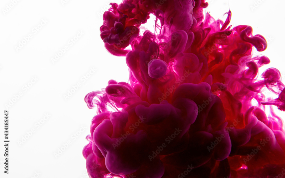 Ink drop in water. Abstract background. Pink background. Ink drop in water. Abstract background. Pink background.