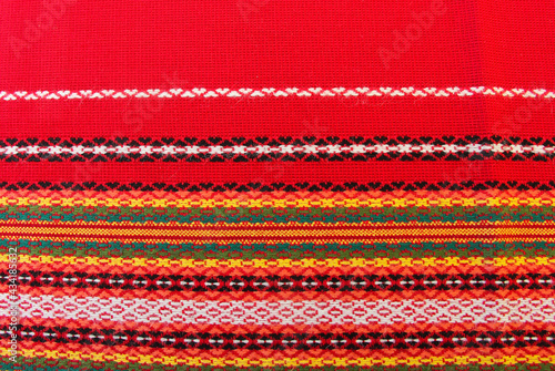 Needlepoint on red fabric.  Bulgarian