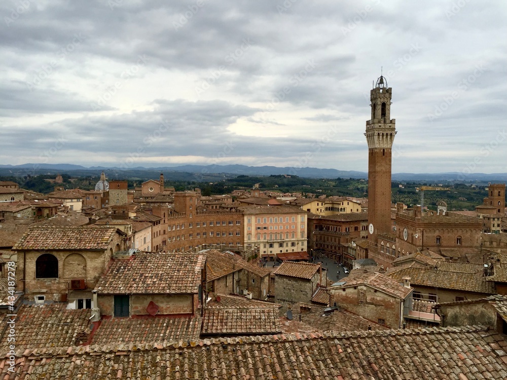SIENA, ITALY. Panorama view of Siena from Cathedral. Aerial view from above the ancient rooftops of the beautiful medieval city to piazza del Campo and Torre del Mangia. 28.09.2015
