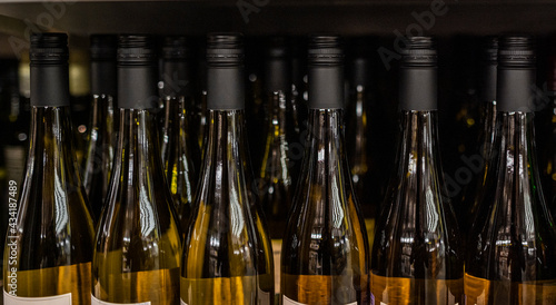 bottles of wine are on the shelves in a large store 