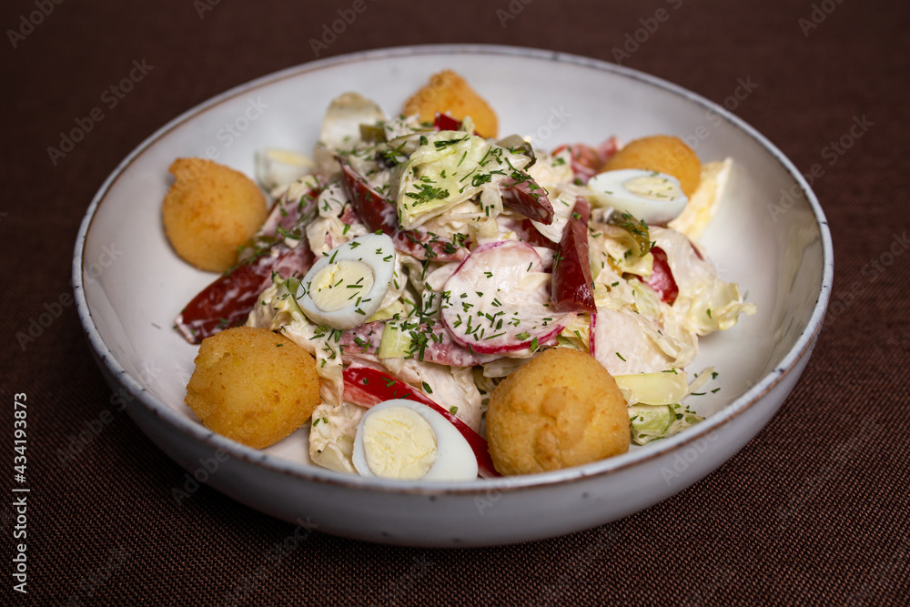vegetable salad and eggs with cheese balls clouse-up