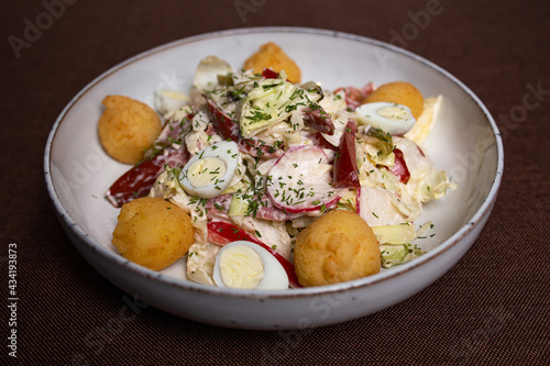 vegetable salad and eggs with cheese balls clouse-up