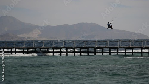 Kitesurfing kiteboarding on the waves in the Red Sea. Touristic resort Sharm El Sheikh Egypt 