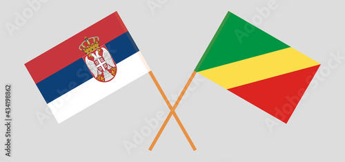 Crossed flags of Serbia and Republic of the Congo. Official colors. Correct proportion