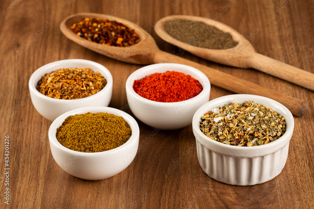 Variety of spices and seasonings on the table. Variety of spices and seasonings on the table.