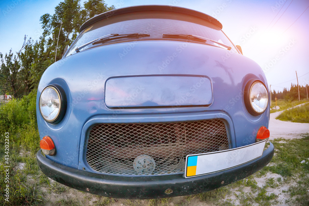 Front-side view of a car on nature background