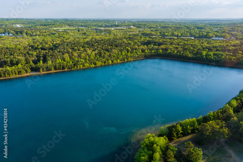 Scenic view of a lake water landscape scene between green forest