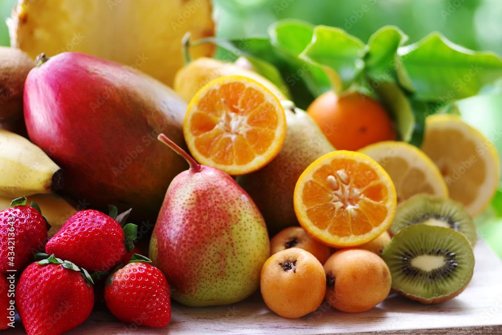 strawberry, loquats, mango, pears and sliced citric fruits strawberry, loquats, mango, pears and sliced citric fruits