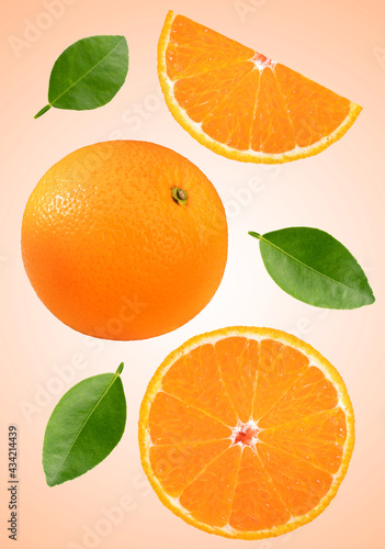 Orange with green leaf isolated on orange background, Fresh Orange and slice on orange With clipping path.
