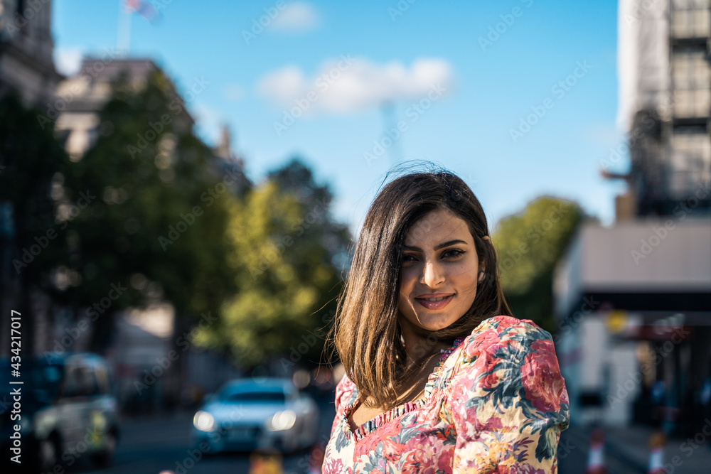 Portrait of a beautiful young woman outdoors in the city. Urban landscape. Travel and freelance lifestyle. Youth and beauty Portrait of a beautiful young woman outdoors in the city. Urban landscape. Travel and freelance lifestyle. Youth and beauty
