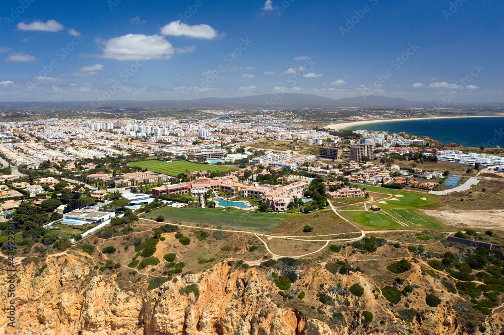Portuguese southern golden coast cliffs. Aerial view over city of Lagos in Algarve, Portugal.