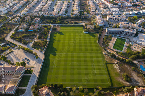 Aerial view over city of Lagos in Algarve, Portugal. Football training. Southern golden coast.