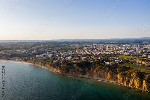 Canavial Beach. Portuguese southern golden coast cliffs. Aerial view over city of Lagos in Algarve, Portugal.