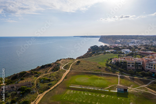 Canavial Beach. Portuguese southern golden coast cliffs. Aerial view over city of Lagos in Algarve, Portugal.