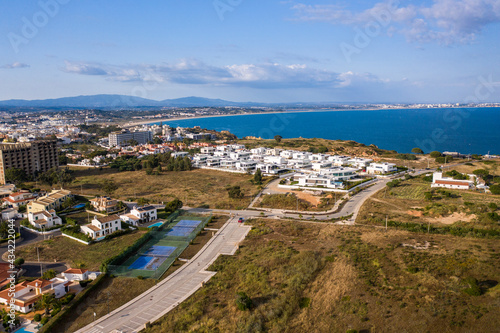 Canavial Beach. Portuguese southern golden coast cliffs. Aerial view over city of Lagos in Algarve, Portugal.