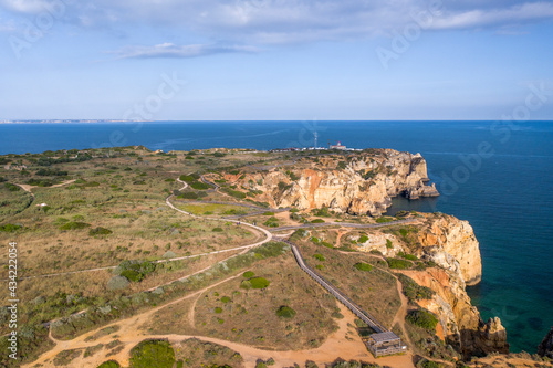 Ponta da Piedade and Canavial Beach. Portuguese southern golden coast cliffs. Aerial view over city of Lagos in Algarve, Portugal.