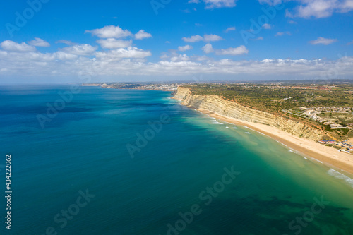 Canavial Beach. Portuguese southern golden coast cliffs. Aerial view over city of Lagos in Algarve, Portugal.
