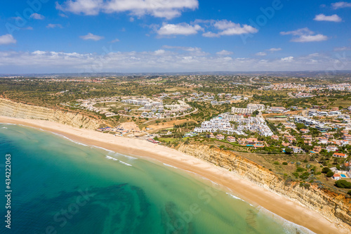 Canavial Beach. Portuguese southern golden coast cliffs. Aerial view over city of Lagos in Algarve, Portugal.