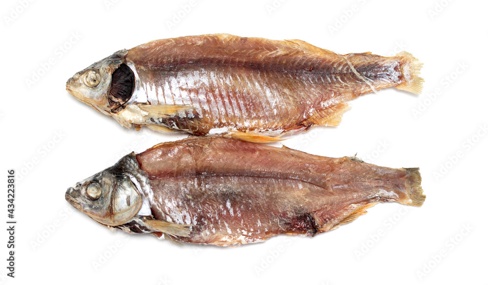 dried fish where the skins are on a white background dried fish where the skins are on a white background