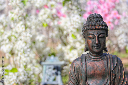 Buddha Statue in Outdoor Garden With Blurred Background