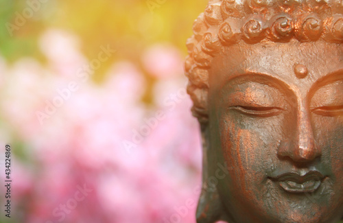 Buddha Statue in Outdoor Garden With Blurred Background © LMPark Photos