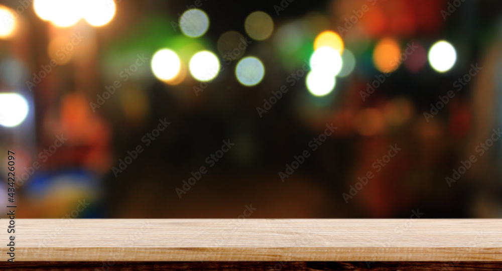 Empty wood table night street with bokeh background. Empty wood table night street with bokeh background.