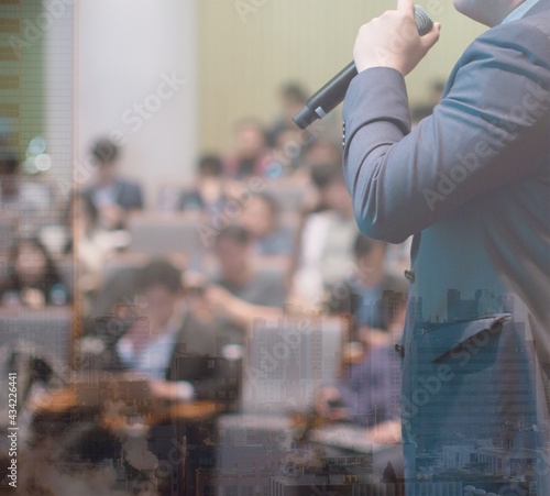 Business People Meeting and Working while Business Executive Lead Presenter Speaks to Group of Successful Technology Entrepreneurs. Consultant Advisor. Growth Training Lecture. Defocused Blurred 