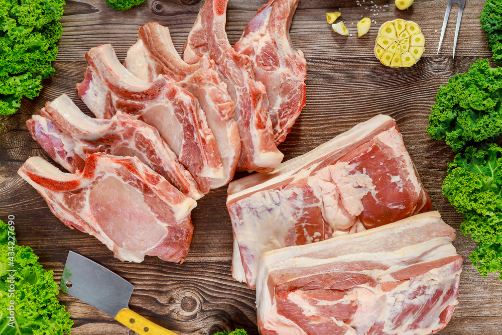 Cut pork meat chop bone in and pork belly.