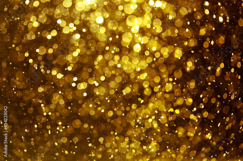 Vintage gold bokeh created by neon lights with black background