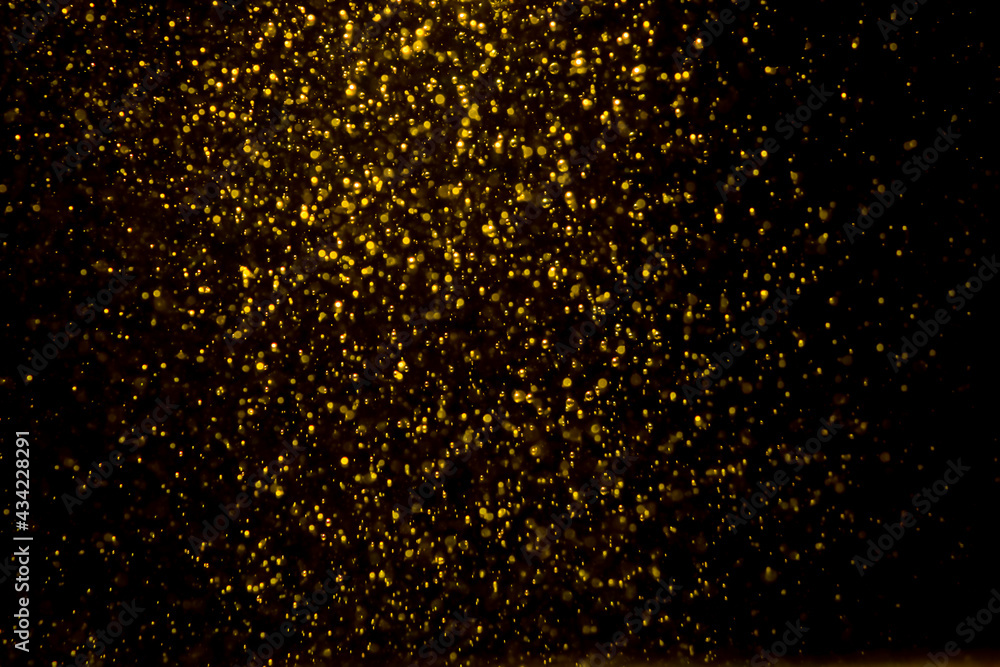 Gold bokeh of lights from water