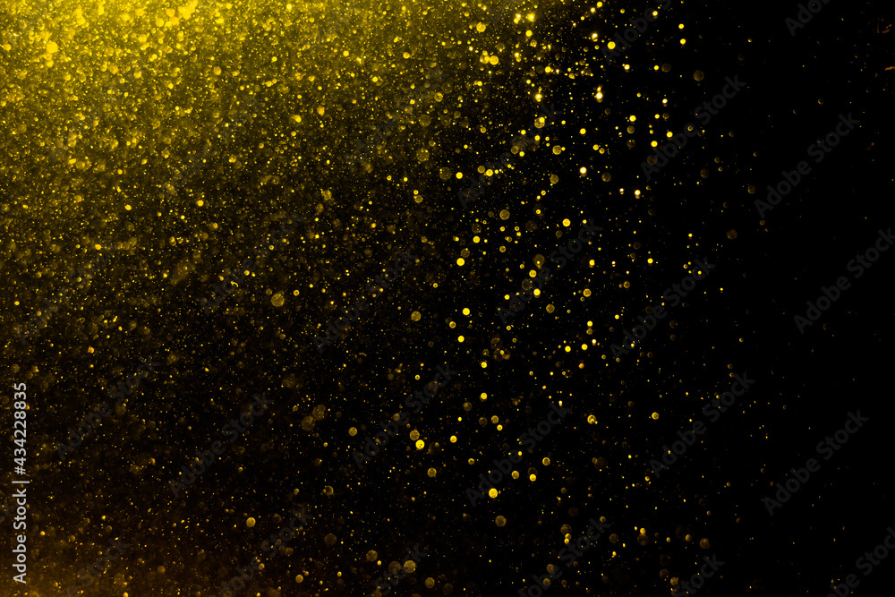 Glittering stars of blur gold bokeh Glittering stars of blur gold bokeh