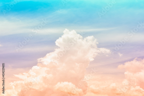 Hazy small cirrostratus, cirrocumulus and cumulus cloud formations on a sunny afternoon in late summer are contrasted against the blue sky.