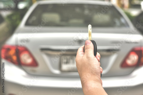 In selective focus of Hand presses on the remote control car alarm systems