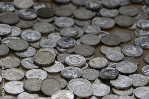 a pile of coins scattered on the floor